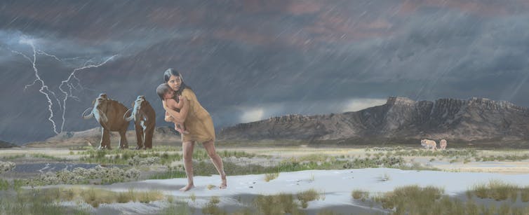 足跡化石から伺える子供を抱え足早に荒野を進む女性の想像図。