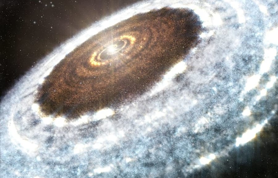 原始惑星系円盤のイメージ。若い恒星を取り巻く岩石などの塵や、氷の粒が惑星形成の材料となる。