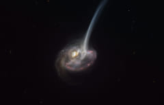 大量のガスを放出している遠方銀河「ID2299」。放出されるガスが尾のような構造を見せている。