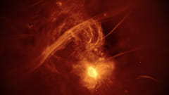 銀河中心の混沌とした様子を映した画像。明るい部分はいて座A*。電波の泡の領域からは、複雑な巻雲のような放射が伸びており、これは画像の大部分を占めている。