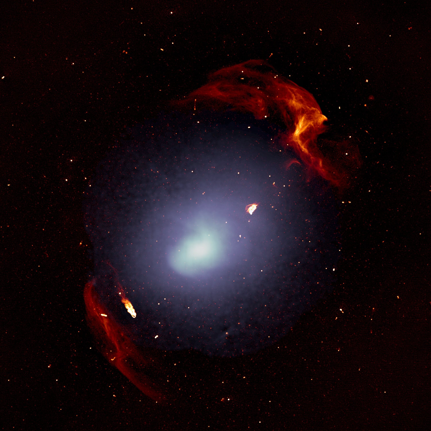 銀河団エイベル3667。個々の銀河は小さすぎて画像には映っていない。白いモヤは銀河団に浸透するガスの分布。赤い構造がエイベル3667が掲載された際に生じた衝撃波。