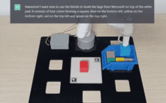 実物のロボットアームが人間の指示で「Microsoft のロゴ」をブロックで作成する